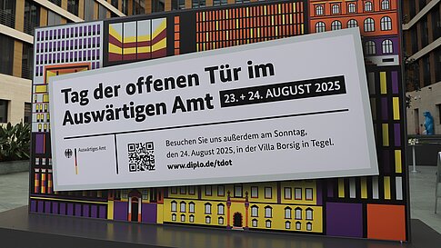 Graphically designed poster with a mosaic of modern and historic buildings in the background, overlaid with a large sign showing the dates for the Open Day at the Federal Foreign Office in Berlin.