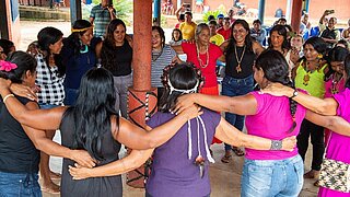 Indigenous women from Brazil performing a circle dance