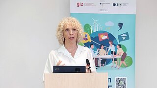 A woman at the lectern