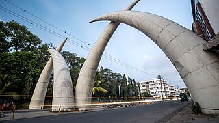 Mombasa Tusks consisting of two giant metal tusks bending over a multi-lane road