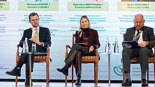 Three people at a panel discussion.
