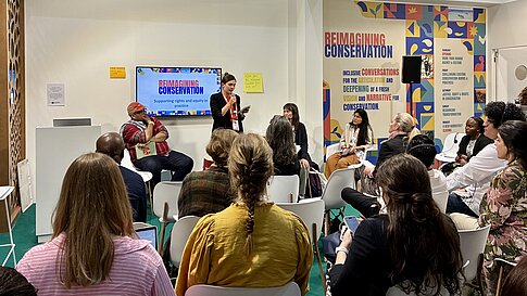 Participants listening to a talk during the IUCN Congress.