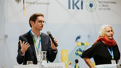 Discussion with two panel participants with microphones.