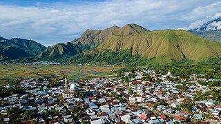 Photo of the province of West Nusa Tenggara. The picture was taken from a mountain and another mountain massif can be seen in the background.
