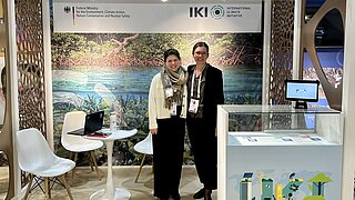 IKI booth with two persons at the IUCN World Conservation Congress.