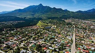 Aerial view of the town of George, with mountains in the background 