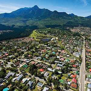 Aerial view of the town of George, with mountains in the background 