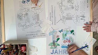Colouring sheets photographed from above