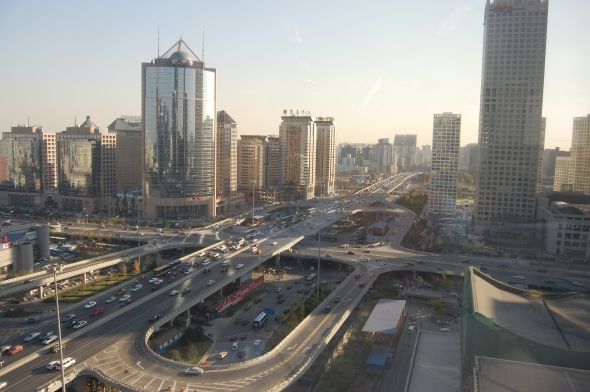 Big streets with many cars infront of skyscrapers in Beijing