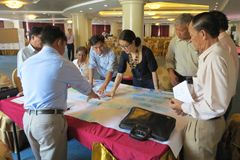 Participants working on a project paper