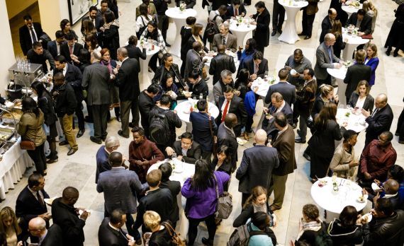 Participants of the Global NDC Conference 2017 are standing together at a meeting area. Photo: GIZ/Reinaldo Coddou