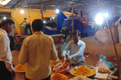 Two men at a market stall. Picture GIZ India