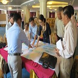 Participants working on a project paper