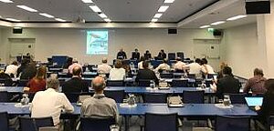 Zuhörerende bei einer Präsentation über eine neue Publikation zu Standards während der OEWG in Wien; Foto: GIZ Proklimat